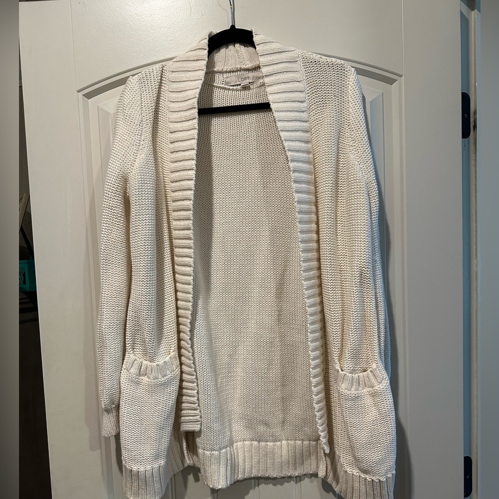 White cardigan.